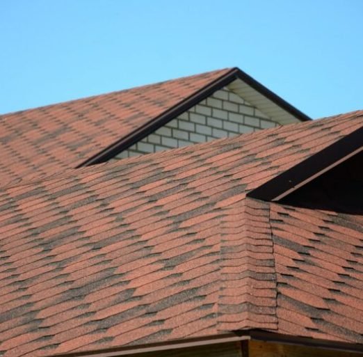 the-roof-is-covered-with-bituminous-shingles-of-brown-color-quality-roofing-768x509